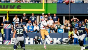 Brock Purdy lance le ballon sous le maillot des 49ers face aux Seahawks à Seattle, octobre 2026
