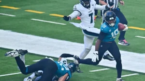 Un joueur des Jaguars de Jacksonville balle en main face aux Eagles au Tottenham Hotspur Stadium, octobre 2026